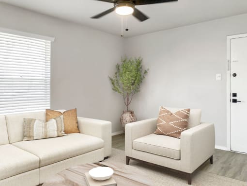a living room with two couches and a coffee table  at Sunset Heights, San Antonio, Texas