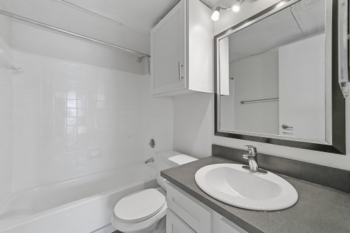 a bathroom with a sink toilet and bathtub  at Vesper, Texas, 75254