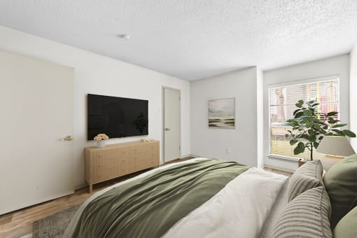 a bedroom with a large bed and a flat screen tv  at Vesper, Dallas, TX, 75254