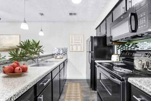 our apartments offer a modern kitchen  at Vesper, Dallas, TX