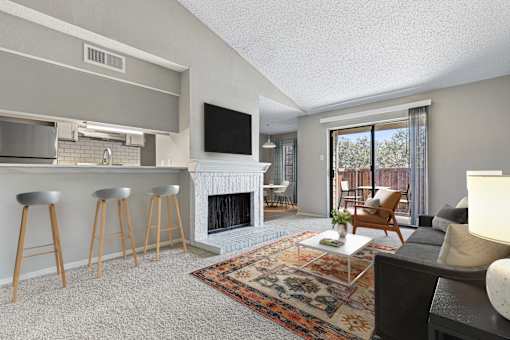 A living room with a fireplace and a television.