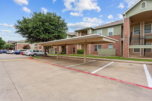 the enclave at green valley apartments parking lot and building