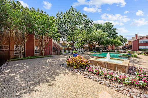 A residential area with a pool and a garden.