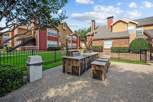 A sunny day at a residential area with houses and a park.