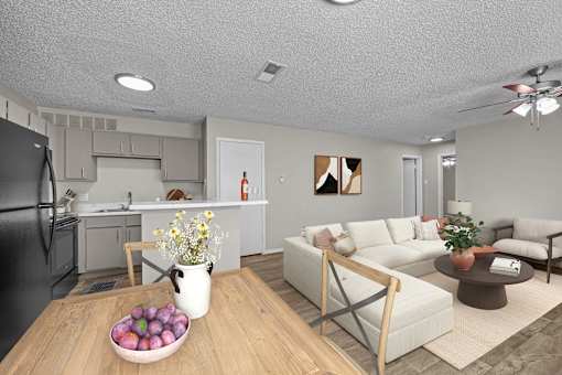 A modern kitchen with a black refrigerator and a dining table with a bowl of fruit on it.