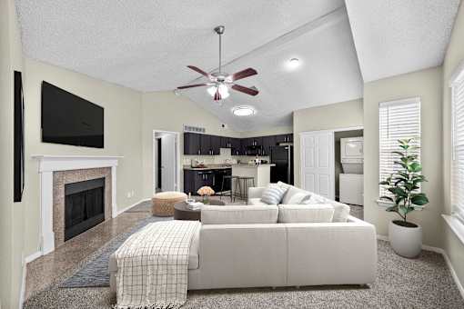 A living room with a fireplace and a couch.