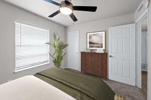 a bedroom with a large window and a ceiling fan  at Sunset Heights, Texas, 78209