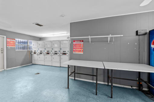 a locker room with lockers and a table  at Sunset Heights, San Antonio