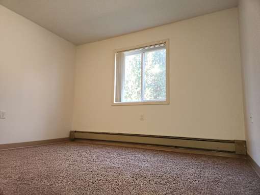 an empty room with a window in it