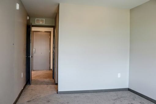 a view of the hallway from the living room