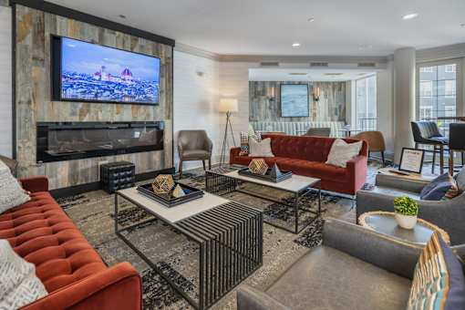 A living room with a television and a couch.