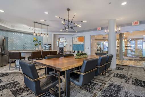 A conference room with a long table and chairs.