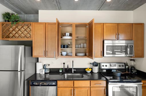 Custom Finishing Packages that include Quartz Countertops, Maple Cabinetry and Stainless-Steel Whirlpool Appliances.
