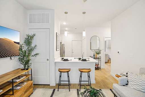 Open concept living area with breakfast bar at Matador Apartments, Austin