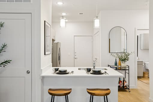 Modern kitchen with breakfast bar seating at Matador Apartments, Texas