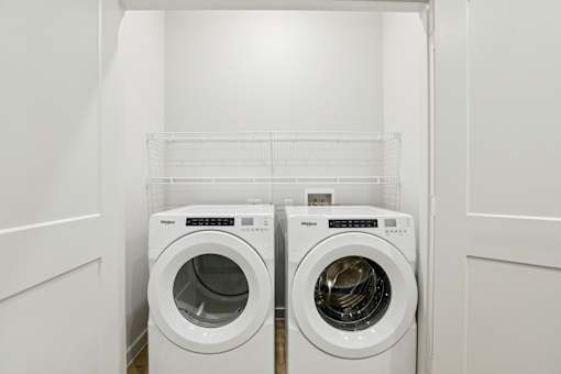 Laundry room with front load washer and dryer at Matador Apartments, Texas, 78745