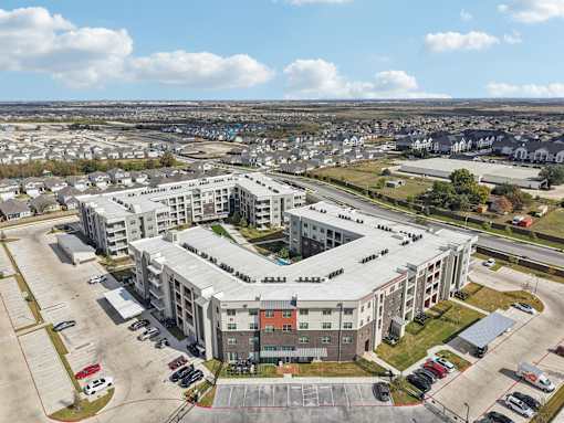 Aerial view of apartment community courtyard at Cantarra Apartments, Manor, Texas