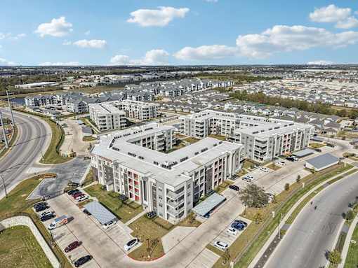 Aerial view of modern apartment community at Cantarra Apartments, Manor