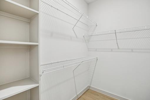 Empty white shelves in a room. at ThreeTwenty at the Vybe Apartments, Kyle, 78640