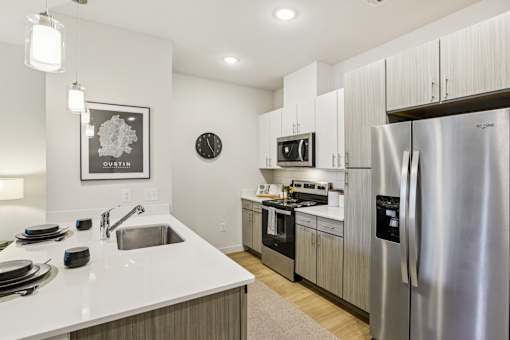 Modern kitchen with stainless steel appliances at Matador Apartments, Austin, TX
