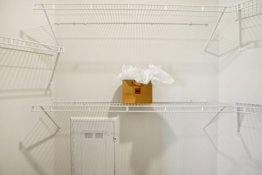 Walk-in closet with wire shelving 1 at Matador Apartments, Texas