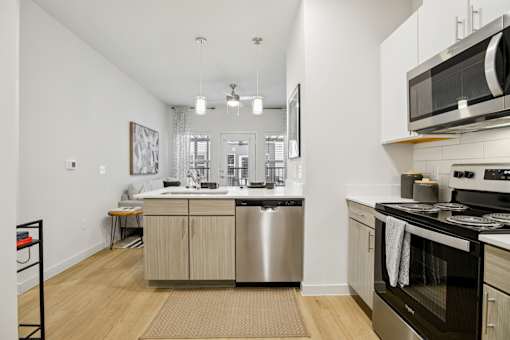 Open kitchen with island and dining area at Matador Apartments, Austin, TX 78745