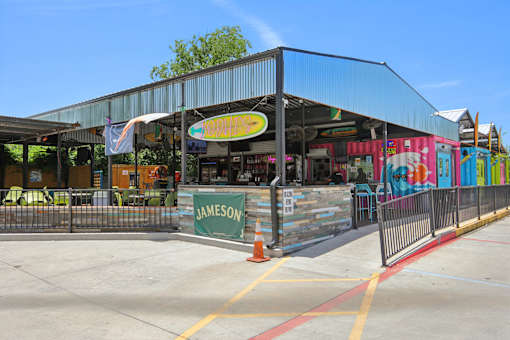 A storefront with a sign at Park South Apartments, Texas, 78748