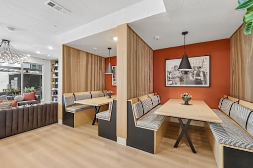 A modern dining area with a wooden table and chairs.
