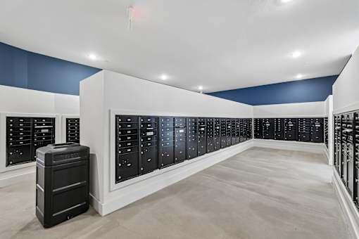 A room with a long row of black filing cabinets.