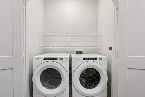 Laundry room with front load washer and dryer 1 at Matador Apartments, Austin, TX 78745