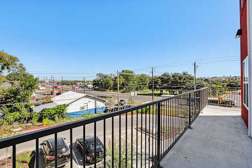 Outdoor balcony with street and neighborhood views at Matador Apartments, Austin, TX