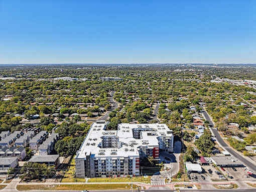 Aerial view of apartment building with rooftop parking at Matador Apartments, Austin, 78745