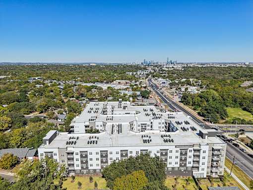 Aerial view of rooftop with downtown skyline at Matador Apartments, Texas, 78745