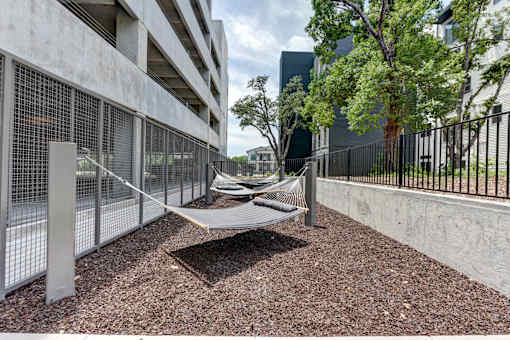 A playground area with a slide and a climbing frame.