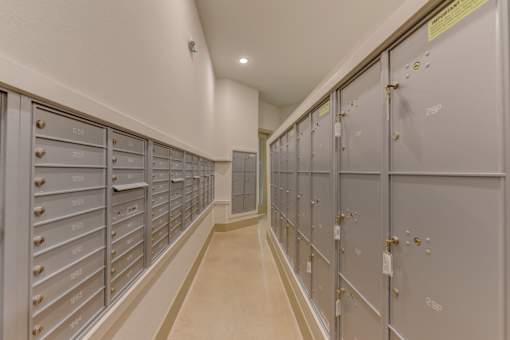 Mail room with parcel lockers and unit mailboxes at Cantarra Apartments, Manor, Texas