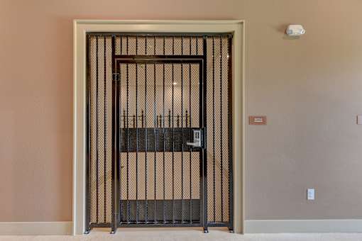 Security gate entrance with access control panel at Cantarra Apartments, Manor