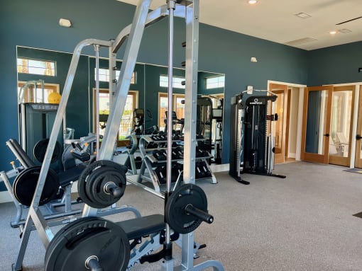 a gym with weights and other exercise equipment at Delco Flats, Austin, 78717