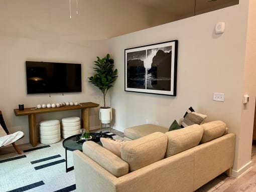 a living room with a couch and a television at windsor park towers