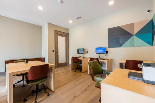 Business center with computers and printer at Bridge at Paloma Affordable Apartments 78754 Northeast Austin