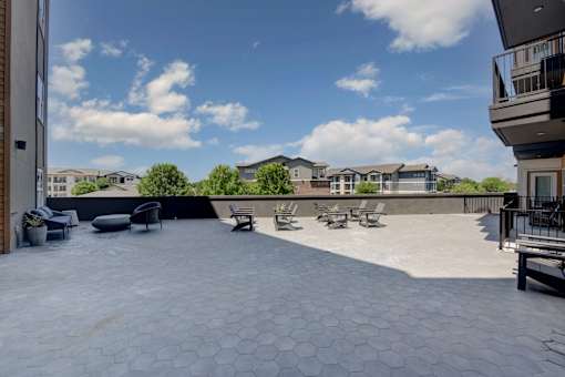 A sunny day at the rooftop patio with hexagonal tiles.