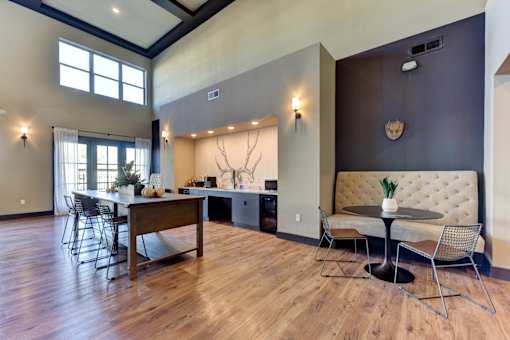 A dining room with a wooden table and chairs.