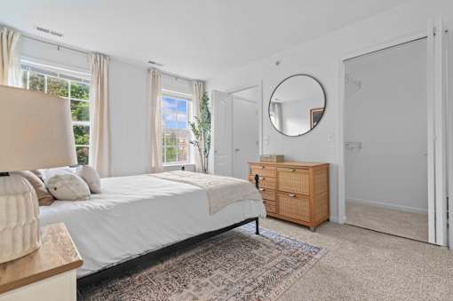 Spacious bedroom with large windows and natural light at Regents Club of Troy Apartments, Michigan, 48084