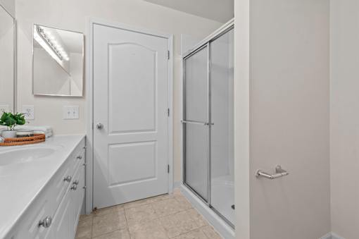 Bathroom with shower enclosure and vanity at Regents Club of Troy Apartments, Michigan, 48084
