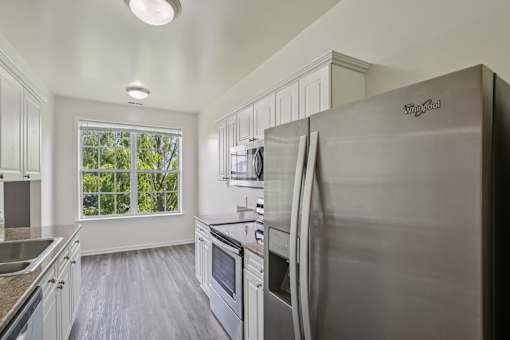 A kitchen with a Wing Goal refrigerator.