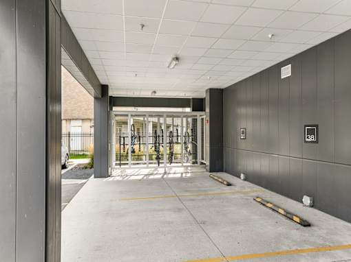 A parking garage with a yellow line on the ground.
