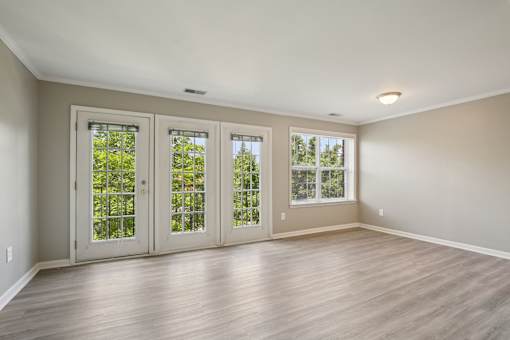A room with a sliding door and a window.