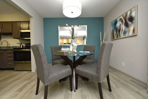 a dining room with a table and chairs