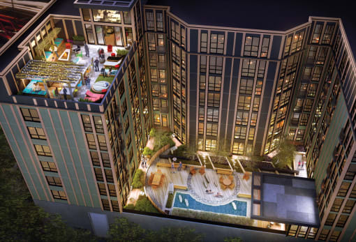 a rendering of a hotel at night with a pool and a courtyard at Ann Arbor City Club, Ann Arbor, MI 48104