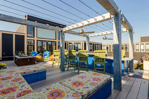 a patio with a table and chairs and a pergola at Ann Arbor City Club, Ann Arbor Michigan