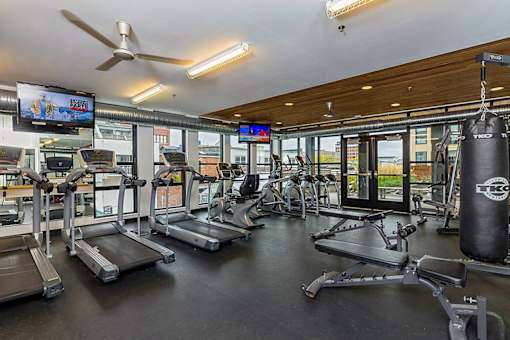 the gym is equipped with cardio equipment and televisions at Ann Arbor City Club, Ann Arbor, MI 48104